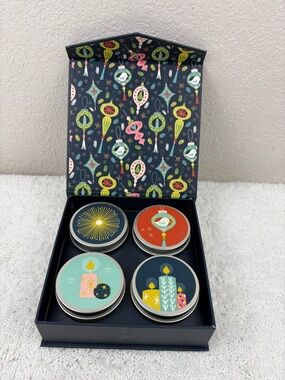 NIB GoodLight Box Set with Four 2oz Candles in Tins.